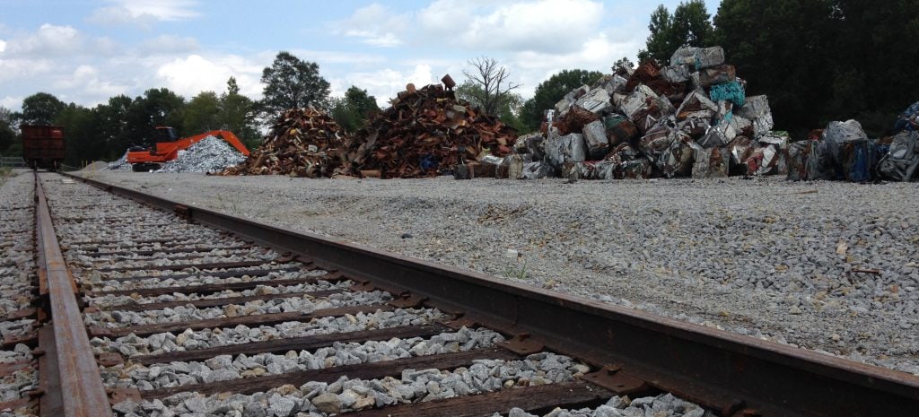 SLM Recycling | scrap metal next to railroad track